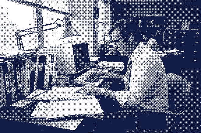 Illustration: a man copying figures from a printed report into a computer, one finger keeping his place.
